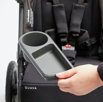 Image of a hand positioning the Roam Snack & Drink Tray